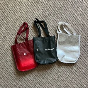 lululemon athletica Red, Dark Green, and Silver Shopping Bags